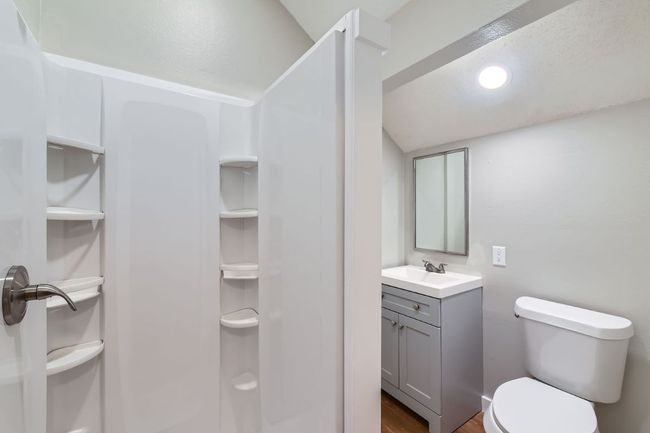 Bathroom with vanity, toilet, wood finished floors, and walk in shower | Image 13