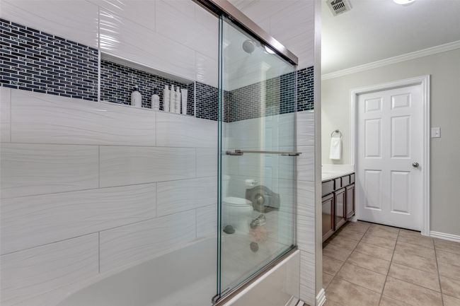 Bathroom featuring custom shower/tub combo | Image 12
