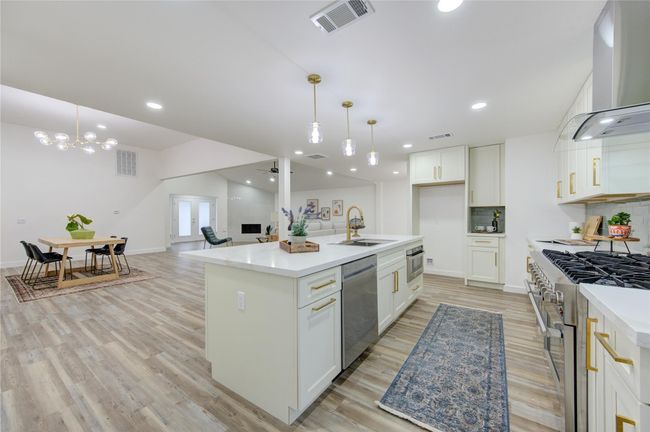 With an open flow into the living and breakfast rooms, this kitchen is designed for both functionality and style, making it perfect for cooking, entertaining, or simply enjoying everyday family life. | Image 13