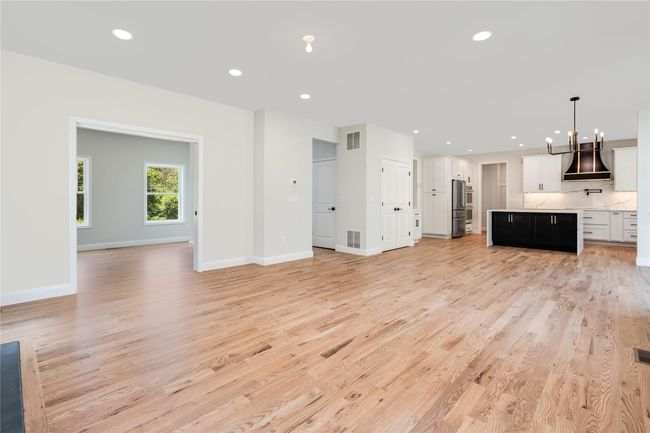 Empty room with baseboards and wood finished floors | Image 17