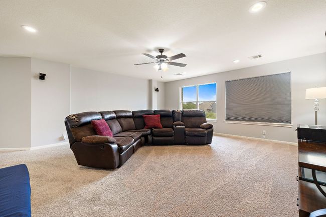 A huge media room/game room is separate from the bonus room and offers an extra living space! | Image 32