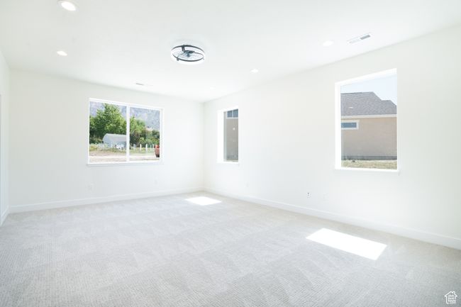 Spare room with light colored carpet and recessed lighting | Image 13