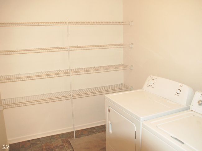 Laundry Room/Pantry Area next to Kitchen. | Image 32