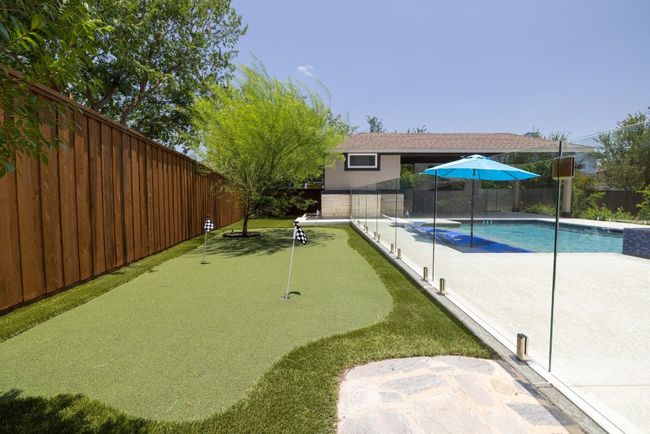 View of swimming pool with a putting area, a fenced backyard, and a​​‌​​​​‌​​‌‌​‌‌​​​‌‌​​‌‌​‌​​​​​‌ patio | Image 40