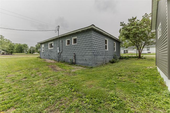View of property exterior featuring a lawn | Image 43