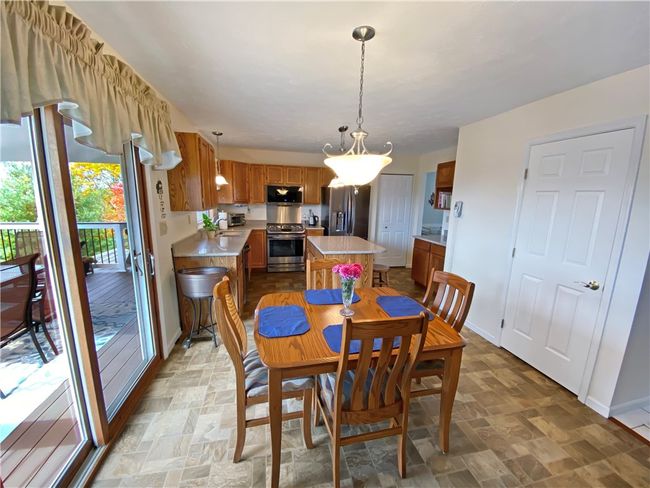 The dinette and a newer sliding glass door that leads to the rear deck. | Image 11
