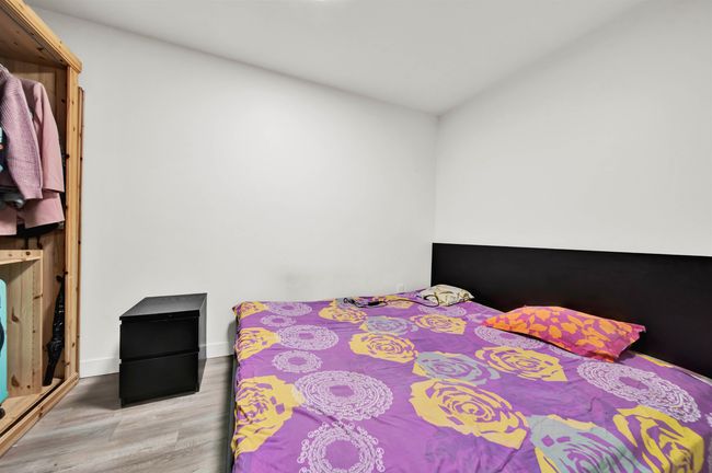 Bedroom featuring light wood finished floors and baseboards | Image 9