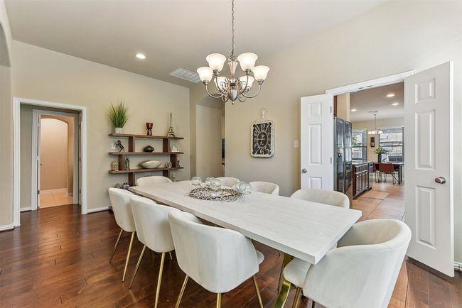 Connected to both the kitchen and living room, this dining area keeps you at the center of it all—ideal for easy entertaining or keeping the conversation flowing during meals | Image 6