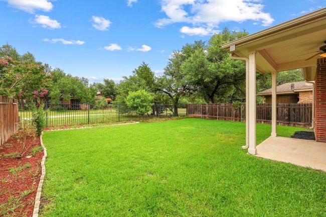 Fenced backyard to greenbelt with walking trail | Image 30