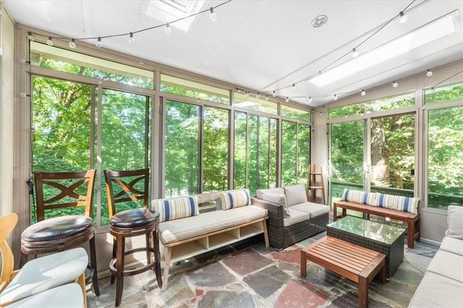 Sunroom / solarium featuring a skylight | Image 14