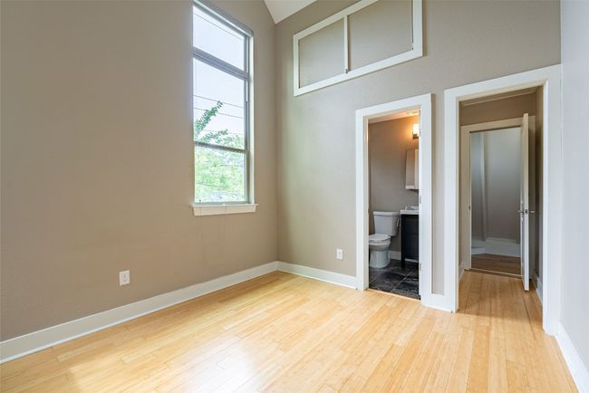 Unfurnished bedroom featuring light wood finished floors and ensuite bath | Image 7