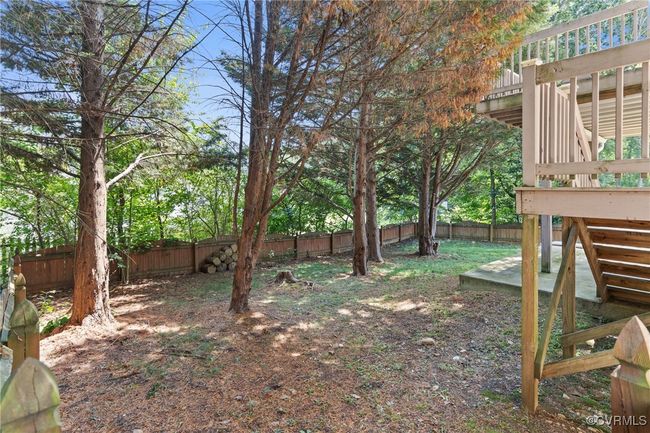 Fenced backyard with a wooden deck and stairs | Image 31