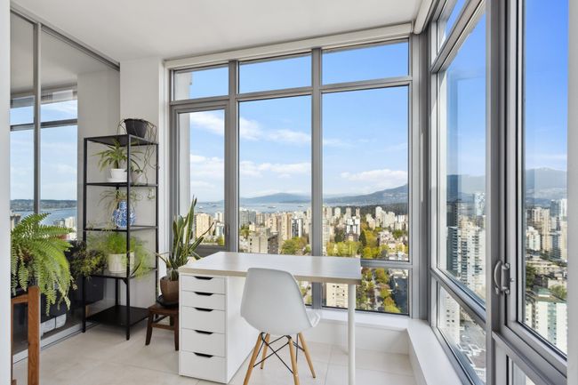 Sunroom / solarium with a view of city, a wealth of natural light, and a water and mountain view | Image 9