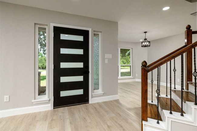 Foyer with wood finished floors, stairway, a chandelier, and recessed lighting | Image 6