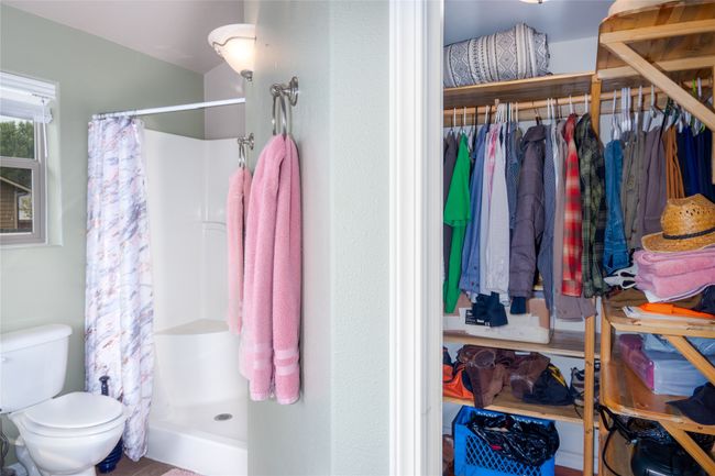 Bathroom featuring a shower stall and toilet | Image 46