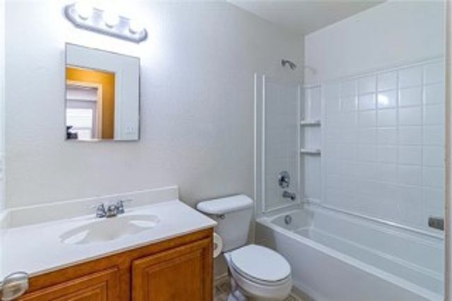 Bathroom with vanity and shower / tub combination | Image 8