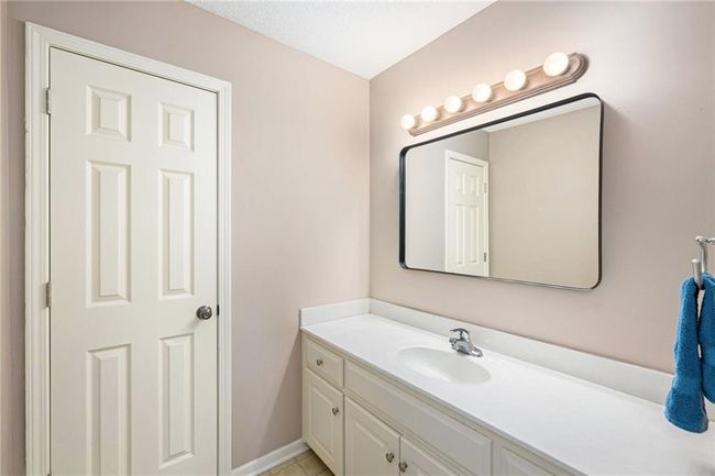 Bathroom featuring vanity and baseboards | Image 20