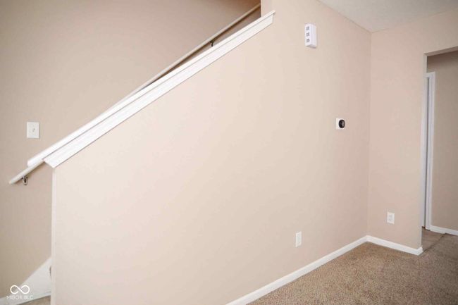 interior space featuring baseboards and carpet floors | Image 10