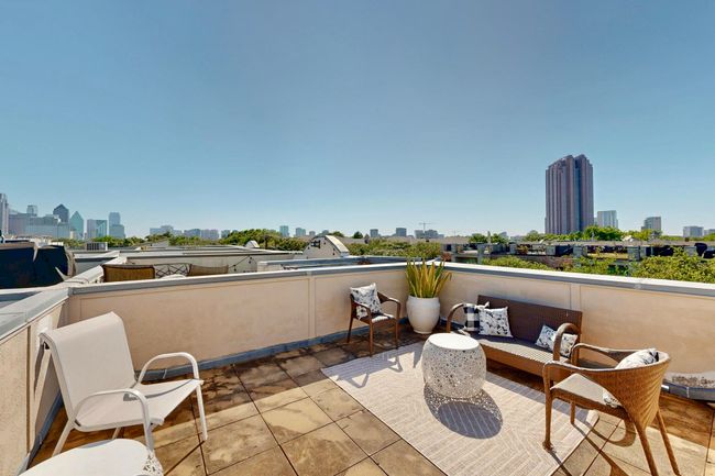 Patio / terrace with a view of skyline and an outdoor hangout area | Image 11