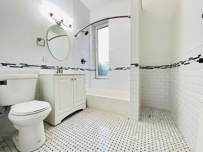 The bathroom has a storage nook. | Image 12