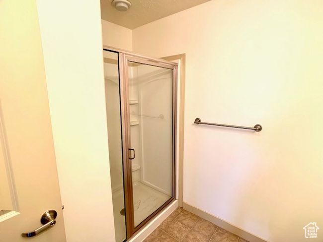 Full bath with a shower stall and baseboards | Image 11