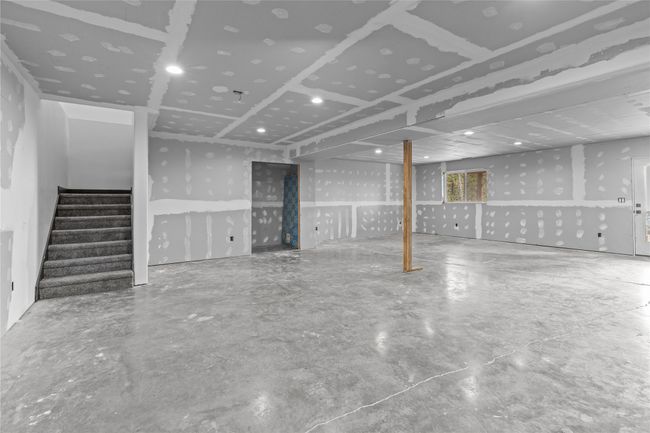Finished basement featuring stairs | Image 45