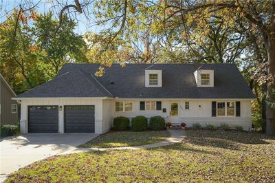 View of front of home featuring a front yard and a garage | Image 2