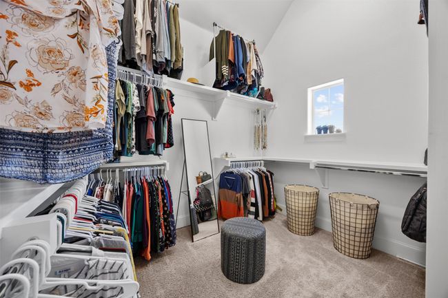 Spacious closet featuring carpet flooring and lofted ceiling | Image 23