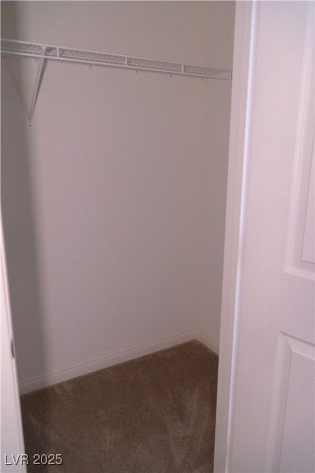 Walk in closet with carpet floors | Image 56