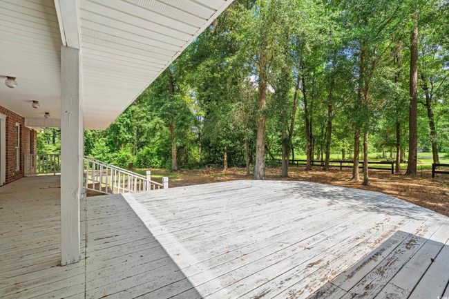 Deck with view of scattered trees | Image 8