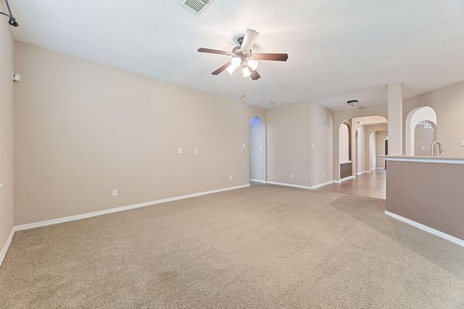 Enjoy some family time in the back room next to the kitchen and breakfast area | Image 13