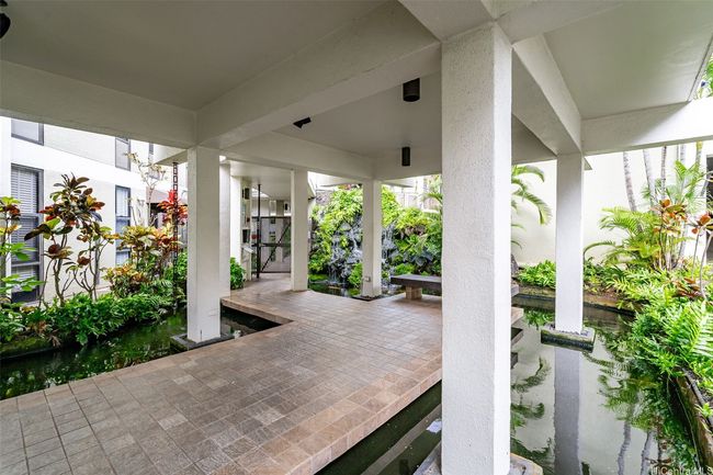 Graceful walkways throughout the property where nature abounds. | Image 24