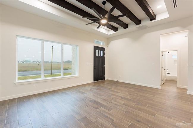 Entrance foyer featuring ceiling fan and beam ceiling | Image 11