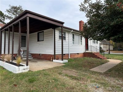 View of front of home with a front lawn | Image 1