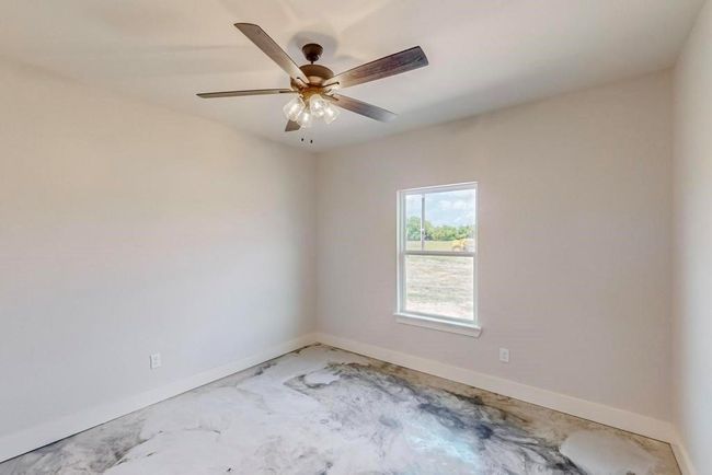 Spare room with baseboards and a ceiling fan | Image 21