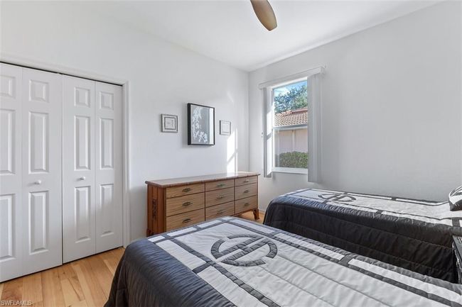 Bedroom featuring a closet, ceiling fan, and light wood-type flooring | Image 21
