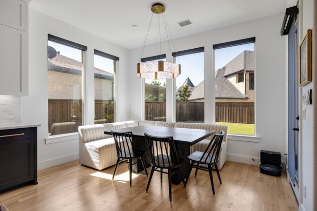 Dining area with breakfast area, light wood-style floors, and baseboards | Image 12