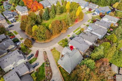 The home is sited on one of the larger lots in the peaceful Village at Sweetbriar which enjoys a lovely park in the center of Trenton Loop. The colorful leaves are gorgeous this time of year! | Image 3