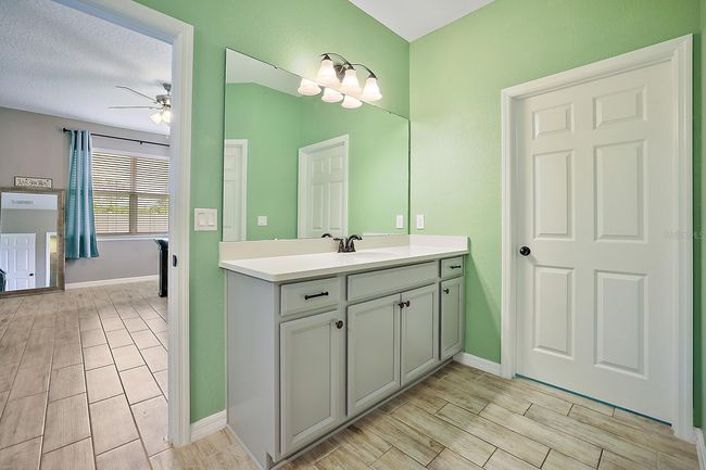 Master bathroom features separate dual vanities | Image 9