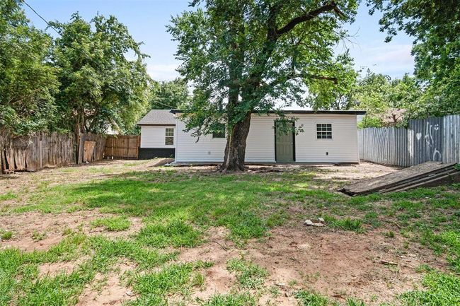 View of fenced backyard | Image 10