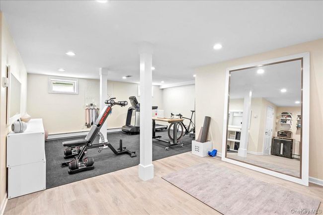Exercise room featuring wood finished floors, recessed lighting, and baseboards | Image 34