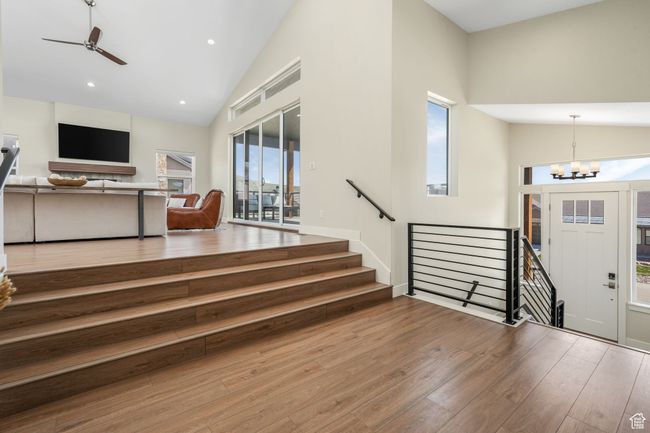 Step into a grand, welcoming entryway that effortlessly flows into the expansive living room, setting the tone for the entire home. | Image 32