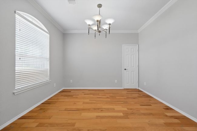 Formal dining area with access to kitchen. | Image 13