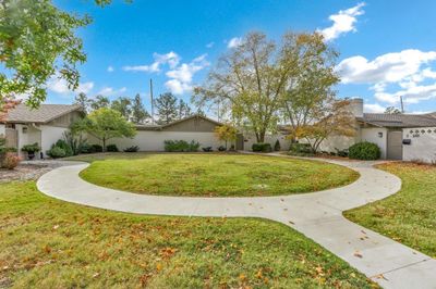 View of front of home featuring a front yard | Image 1