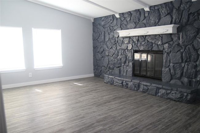 Flex room with this great stone fireplace | Image 22