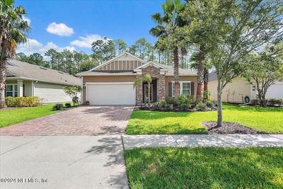 Lush yard with welcoming curb appeal | Image 1