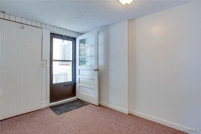 Entryway to 2nd apartment w/textured ceiling and carpet floors | Image 29