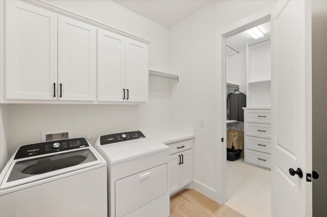Extra storage and closet access in the laundry room | Image 17