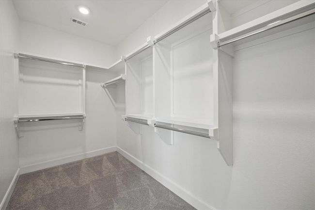 Spacious walk-in closet. | Image 12