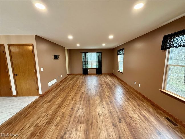 Spare room featuring light wood-style floors, recessed lighting, and baseboards | Image 13